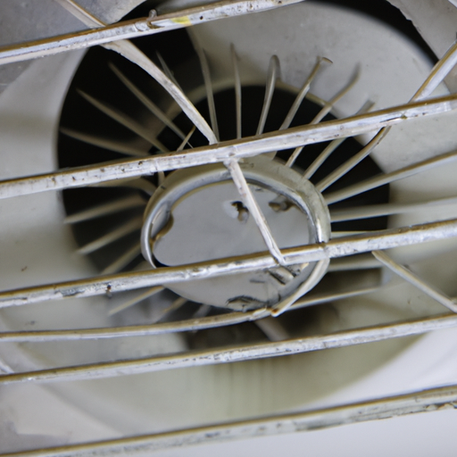 A picture of a dusty kitchen exhaust fan showing the need for cleaning