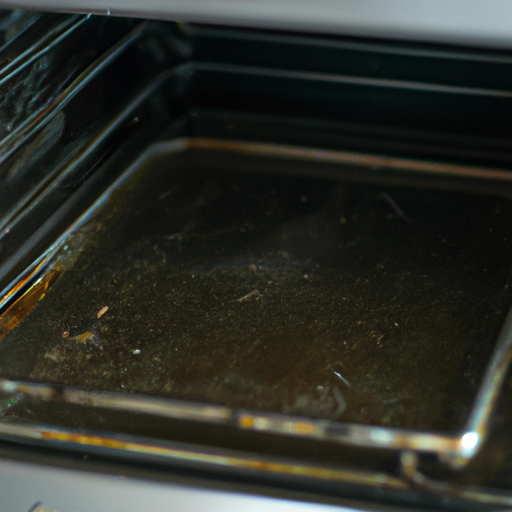A photo showing a dirty oven before the cleaning process begins.