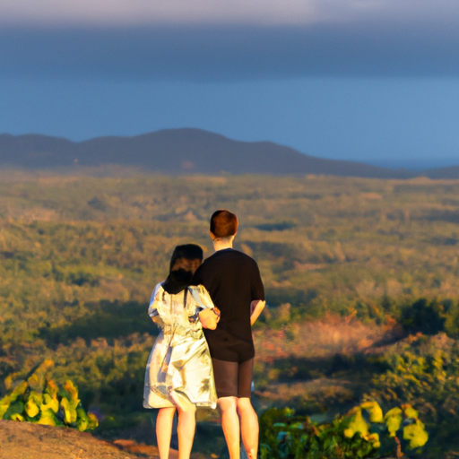 A couple overlooking a panoramic view of Thailand's landscapes